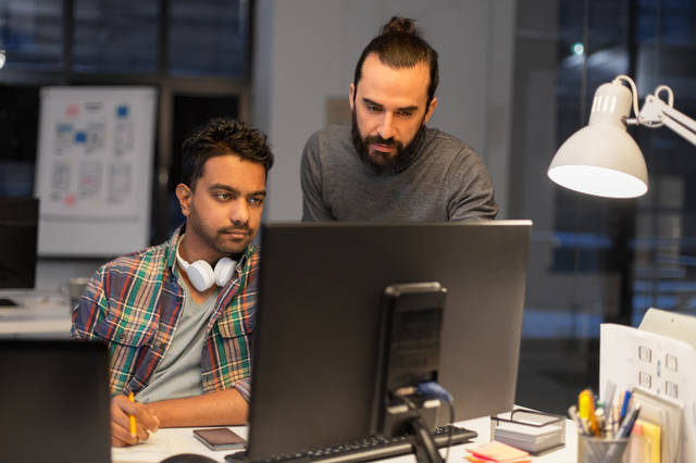 Skilled professionals collaborating on employer-sponsored visa documentation – Better Life Migration Australia Employer Nomination Scheme Visa Subclass 186.